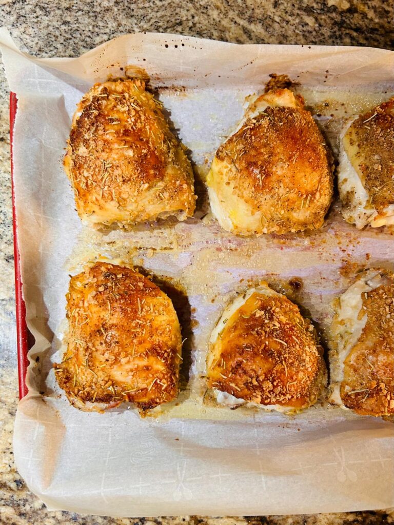 This image feature six chicken thighs that have been baked acording to cow and girl's crispy bake chicken recipe ready to be served. Birds recipe